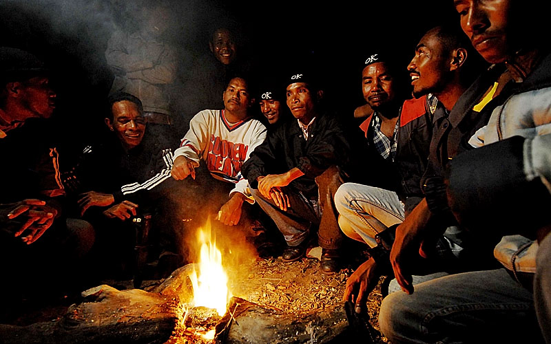 Rebel soldiers in East Timor around camp fire